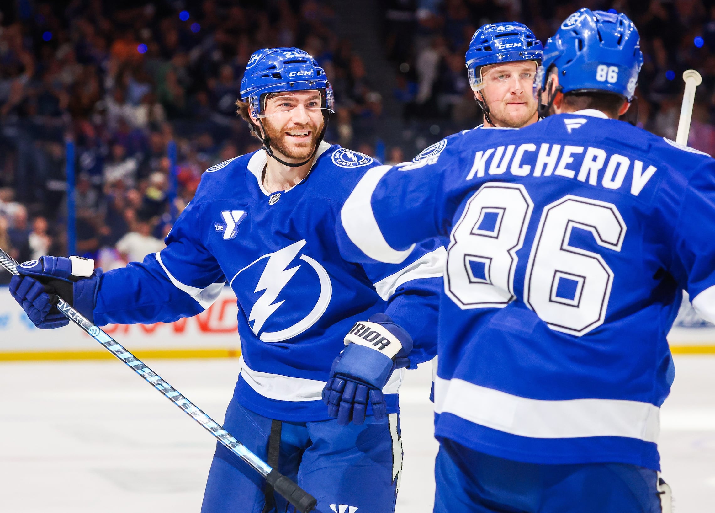 Tampa Bay Lightning center Brayden Point (21) celebrates his goal along with defenseman Darren Raddysh (43) and right wing Nikita Kucherov (86) after beating Ottawa Senators goaltender Linus Ullmark (35) during first period action of the Lightning season opener at Benchmark International Arena on Thursday, Oct. 9, 2025 in Tampa.