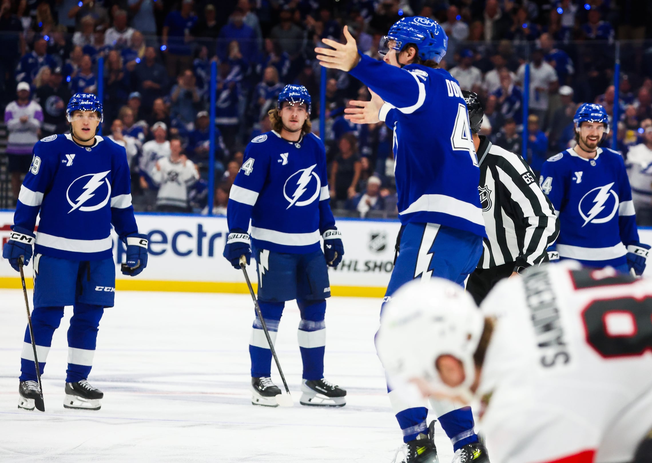 Tampa Bay Lightning center Curtis Douglas (42) motions to the crowd as he heads to the penalty box  after dropping the gloves and fighting Ottawa Senators left wing Kurtis MacDermid (23) during first period action of the Lightning season opener at Benchmark International Arena on Thursday, Oct. 9, 2025 in Tampa.