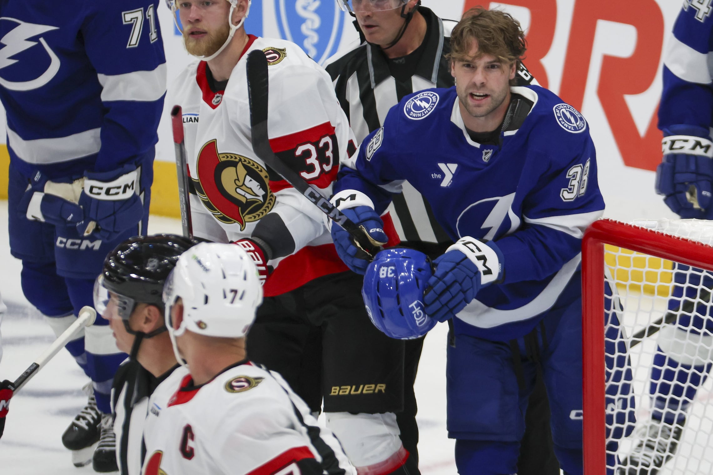 Tampa Bay Lightning left wing Brandon Hagel (38) has words with Ottawa Senators left wing Brady Tkachuk (7) during the first period  on Thursday, Oct. 9, 2025 in Tampa.