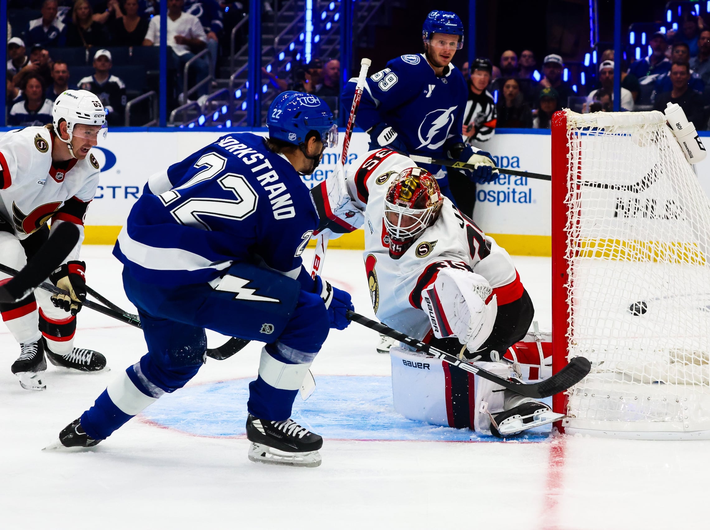 Tampa Bay Lightning right wing Oliver Bjorkstrand (22) shoots and scores beating Ottawa Senators goaltender Linus Ullmark (35) for a power play goal, the first goal of the season, during first period action of the Lightning season opener at Benchmark International Arena on Thursday, Oct. 9, 2025 in Tampa.