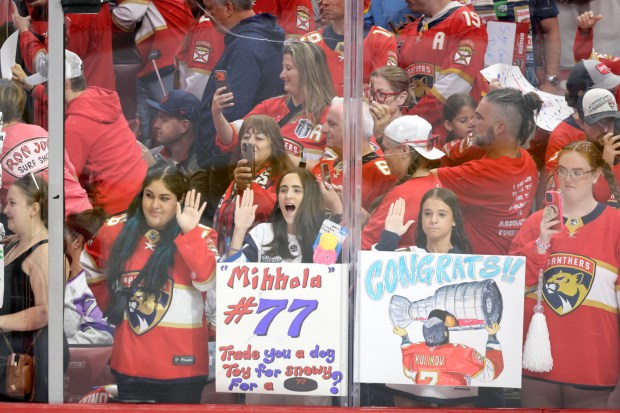 Fans cheer on the team before the start of the...