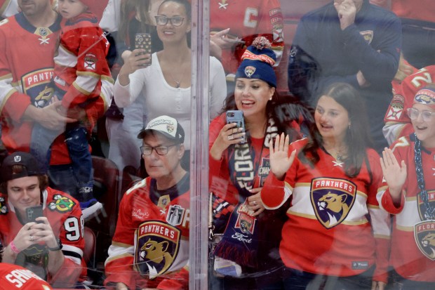 Fans cheer on the team before the start of the...