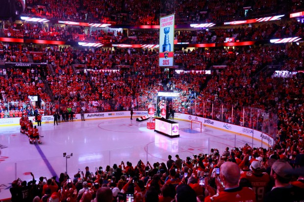 The 2025 Championship banner is raised before the start of...