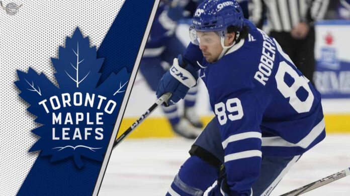 Toronto Maple Leafs forward Nick Robertson skates with the puck during an NHL game.