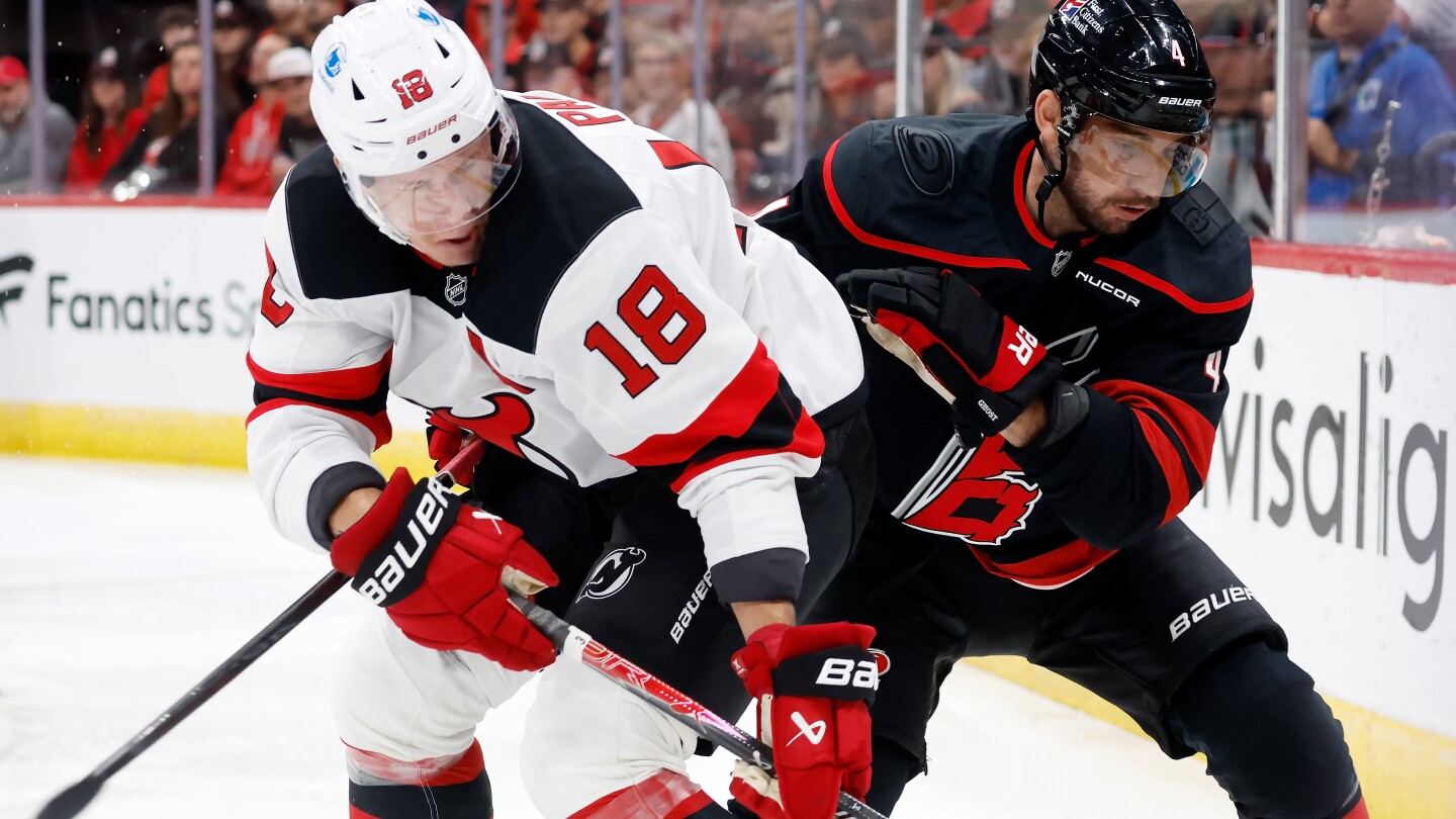 Jarvis, new arrival Miller help Hurricanes beat Devils 6-3 in season opener