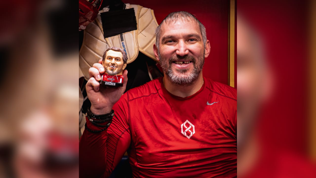 Ovechkin poses with funny floss holder giveaway