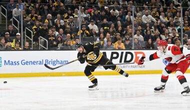 Nov 1, 2025; Boston, Massachusetts, USA; Boston Bruins left wing Viktor Arvidsson (71) scores a goal with pressure from Carolina Hurricanes defenseman Alexander Nikishin (21) during the third period at TD Garden. Mandatory Credit: Eric Canha-Imagn Images