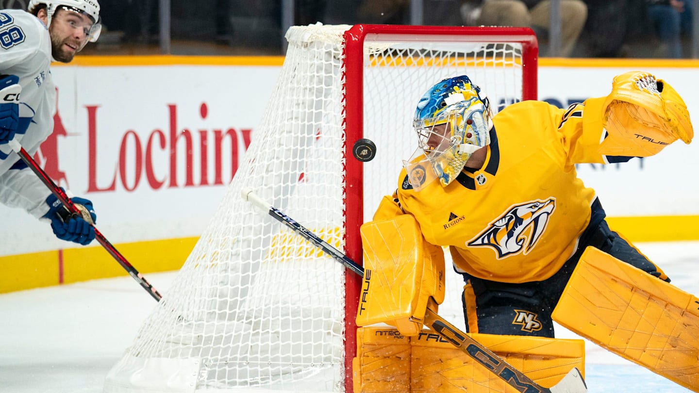 Tampa Bay left wing Brandon Hagel (38) gets off a shot against Nashville goaltender Juuse Saros (74) during their game at Bridgestone Arena in Nashville, Tenn., Tuesday, Oct. 28, 2025. Saros made the save.