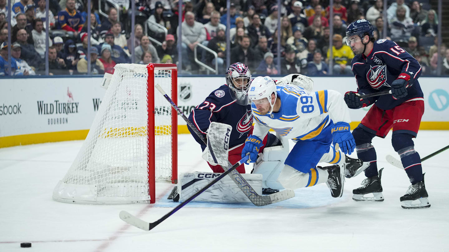 Nov 1, 2025; Columbus, Ohio, USA;  Columbus Blue Jackets goaltender Jet Greaves (73) defends the net as St. Louis Blues left wing Pavel Buchnevich (89) skates against Columbus Blue Jackets defenseman Dante Fabbro (15) in the third period at Nationwide Arena. Mandatory Credit: Aaron Doster-Imagn Images