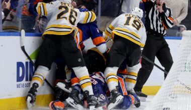 Nov 4, 2025; Elmont, New York, USA; New York Islanders and Boston Bruins players fight after a hit on New York Islanders defenseman Matthew Schaefer (48) by Boston Bruins defenseman Nikita Zadorov (91) during the second period at UBS Arena. Mandatory Credit: Brad Penner-Imagn Images