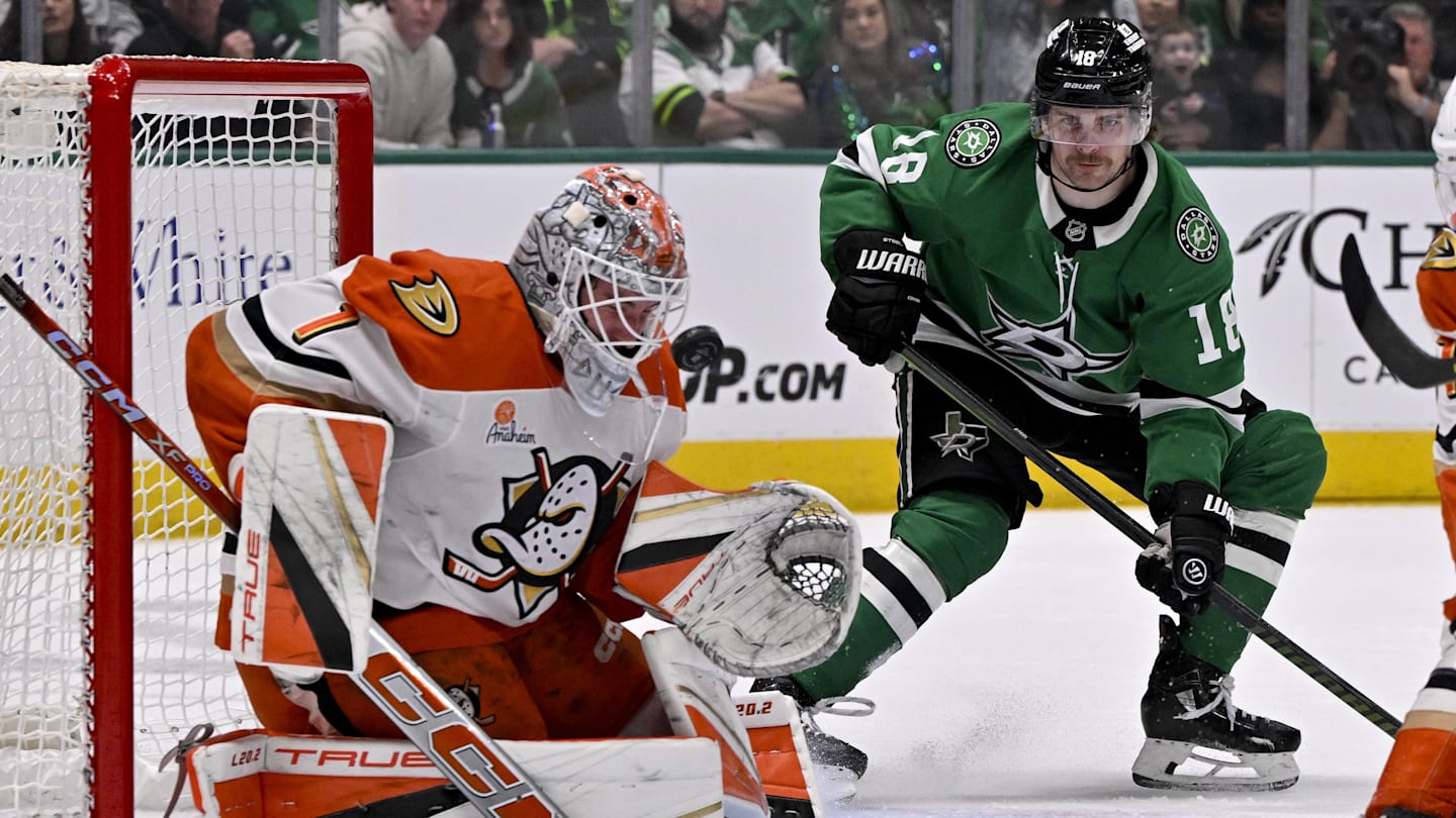 Mar 18, 2025; Dallas, Texas, USA; Anaheim Ducks goaltender Lukas Dostal (1) stops a shot as Dallas Stars center Sam Steel (18) looks for the rebound during the second period at the American Airlines Center. Mandatory Credit: Jerome Miron-Imagn Images