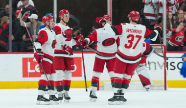 Nov 8, 2025; Raleigh, North Carolina, USA;  Carolina Hurricanes defenseman Charles Alexis Legault (62) celebrates his first NHL goal (empty net) with center Sebastian Aho (20) defenseman Mike Reilly (6) and right wing Andrei Svechnikov (37) against the Buffalo Sabres during the third period at Lenovo Center. Mandatory Credit: James Guillory-Imagn Images