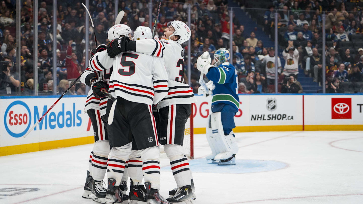 Nov 5, 2025; Vancouver, British Columbia, CAN; Chicago Blackhawks forward Tyler Bertuzzi (59) and defenseman Connor Murphy (5) and forward Colton Dach (34) celebrate Bertuzzi’s first goal of the third period against the Vancouver Canucks at Rogers Arena. Mandatory Credit: Bob Frid-Imagn Images