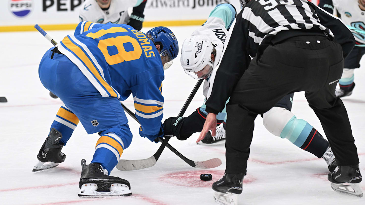 Nov 8, 2025; St. Louis, Missouri, USA; St. Louis Blues center Robert Thomas (18) faces off against Seattle Kraken center Chandler Stephenson (9) in the third period at Enterprise Center. Mandatory Credit: Joe Puetz-Imagn Images
