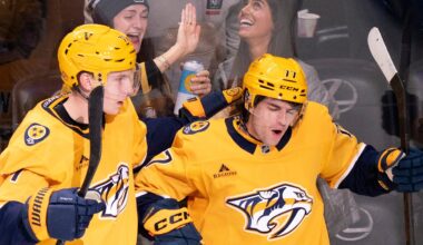 Nashville right wing Matthew Wood (71) and right wing Luke Evangelista (77) celebrate Evangelista’s first goal of the year against Tampa Bay during their game at Bridgestone Arena in Nashville, Tenn., Tuesday, Oct. 28, 2025.