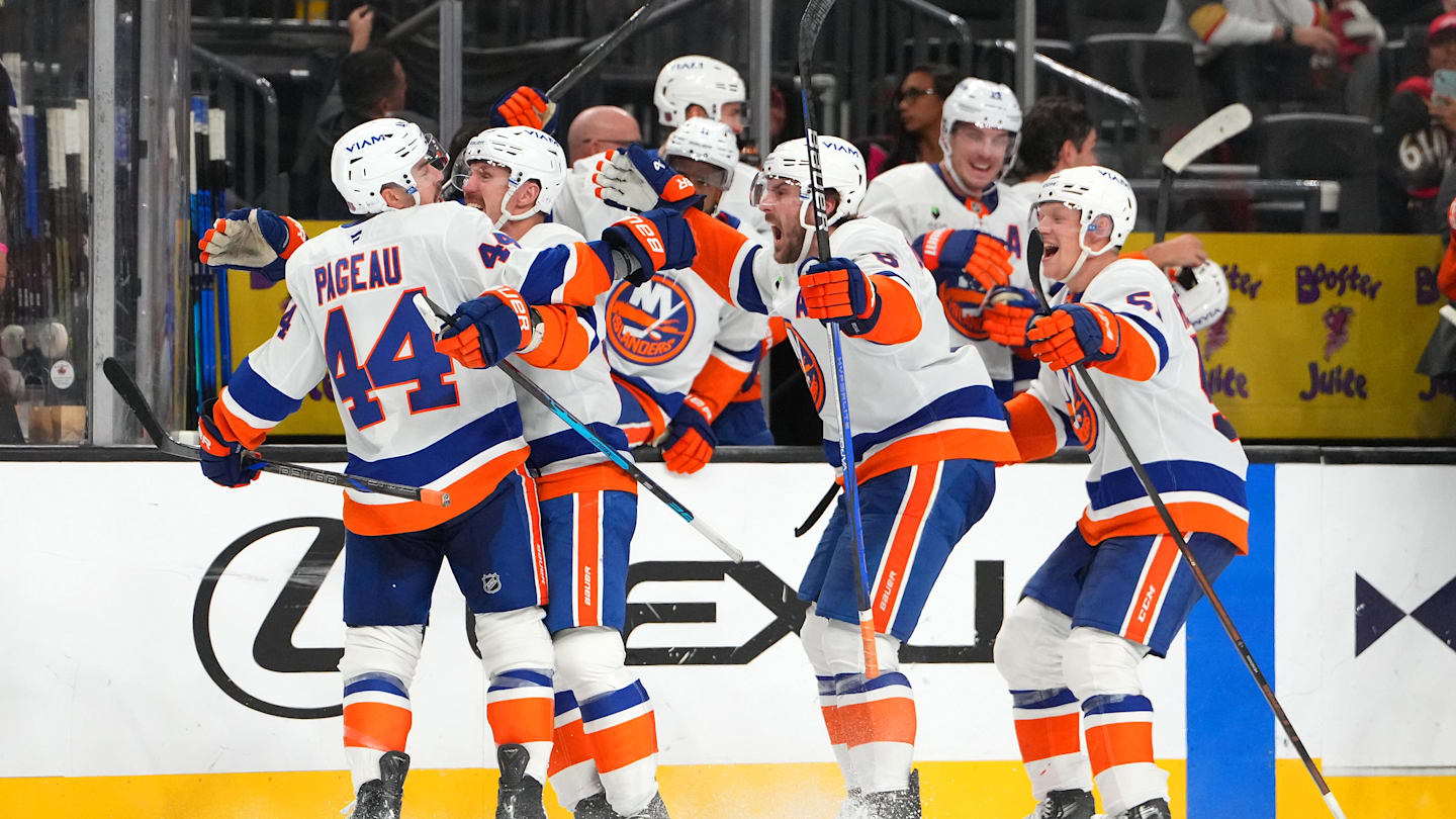 Nov 13, 2025; Las Vegas, Nevada, USA; New York Islanders center Jean-Gabriel Pageau (44) celebrates with team mates after scoring a short-handed goal against the Vegas Golden Knights during an overtime period to give the Islanders a 4-3 victory at T-Mobile Arena. Mandatory Credit: Stephen R. Sylvanie-Imagn Images
