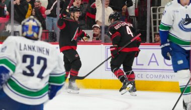Nov 14, 2025; Raleigh, North Carolina, USA;  Carolina Hurricanes left wing Taylor Hall (71) celebrates his goal with  defenseman Shayne Gostisbehere (4) against the Vancouver Canucks during the third period at Lenovo Center. Mandatory Credit: James Guillory-Imagn Images