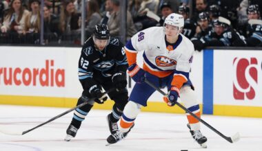 Nov 14, 2025; Salt Lake City, Utah, USA; New York Islanders defenseman Matthew Schaefer (48) skates with the puck against Utah Mammoth center Logan Cooley (92) during the second period at Delta Center. Mandatory Credit: Rob Gray-Imagn Images