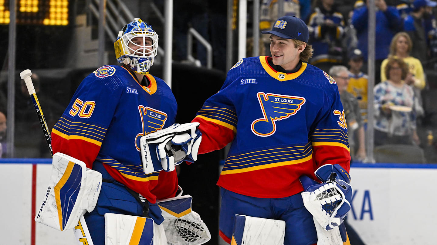 Mar 13, 2024; St. Louis, Missouri, USA;  St. Louis Blues goaltender Jordan Binnington (50) celebrates with goaltender Joel Hofer (30) after the Blues defeated the Los Angeles Kings at Enterprise Center. Mandatory Credit: Jeff Curry-Imagn Images
