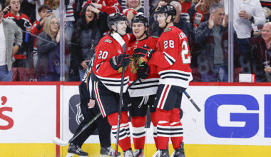 Nov 18, 2025; Chicago, Illinois, USA; Chicago Blackhawks center Connor Bedard (98) celebrates with teammates after scoring against the Calgary Flames during the second period at United Center. Mandatory Credit: Kamil Krzaczynski-Imagn Images