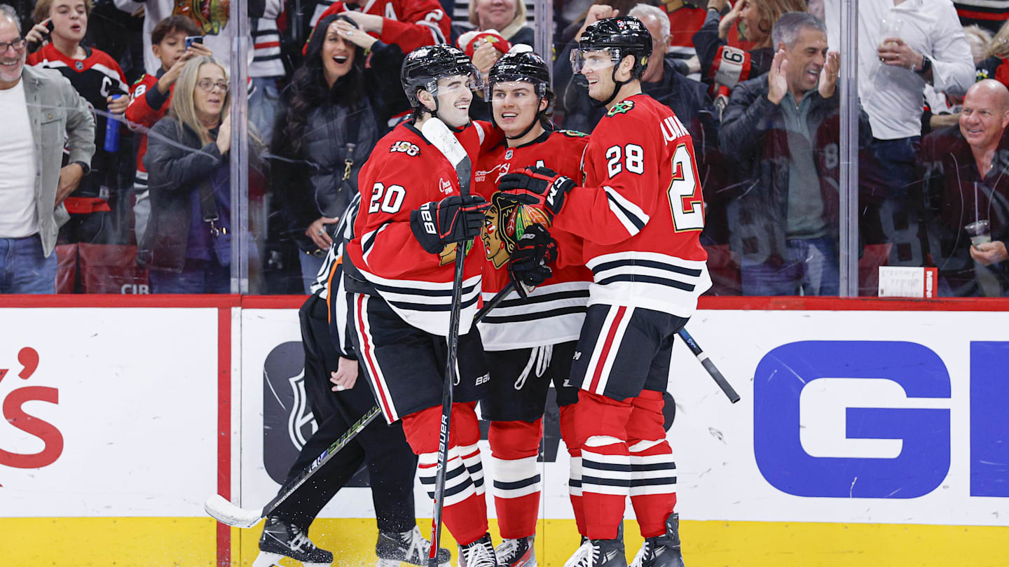 Nov 18, 2025; Chicago, Illinois, USA; Chicago Blackhawks center Connor Bedard (98) celebrates with teammates after scoring against the Calgary Flames during the second period at United Center. Mandatory Credit: Kamil Krzaczynski-Imagn Images