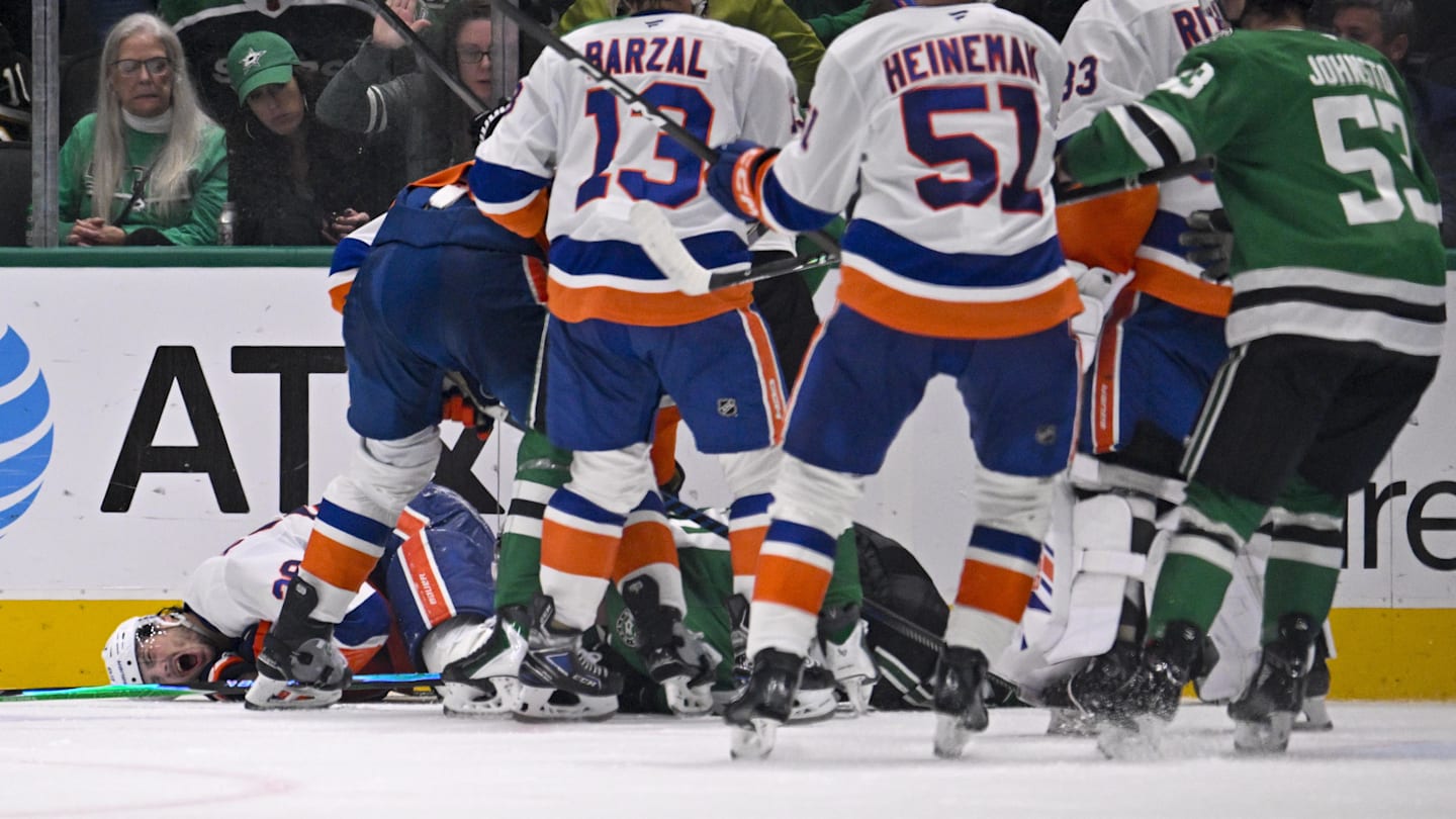 Nov 18, 2025; Dallas, Texas, USA; Dallas Stars right wing Mikko Rantanen (96) is called for a game misconduct penalty for boarding on New York Islanders defenseman Alexander Romanov (28) during the third period at the American Airlines Center. Mandatory Credit: Jerome Miron-Imagn Images