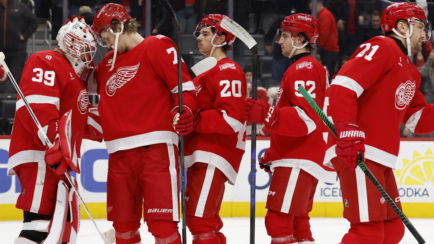 Nov 18, 2025; Detroit, Michigan, USA; Detroit Red Wings goaltender Cam Talbot (39) and defenseman Simon Edvinsson (77) celebrate defeating the Seattle Kraken at Little Caesars Arena. Mandatory Credit: Rick Osentoski-Imagn Images