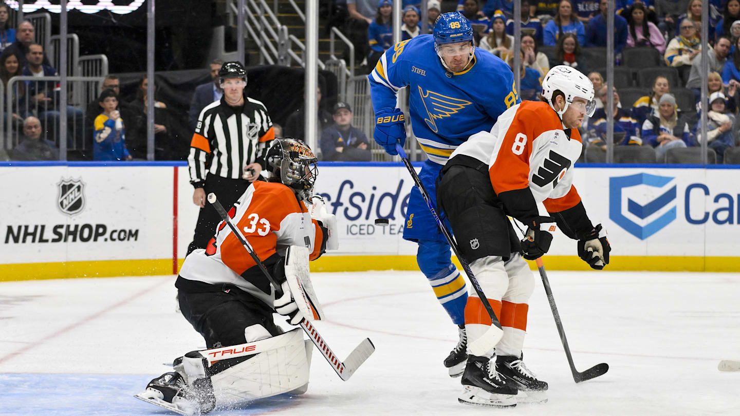 Nov 14, 2025; St. Louis, Missouri, USA; Philadelphia Flyers goaltender Samuel Ersson (33) and defenseman Cam York (8) defend the net against St. Louis Blues left wing Pavel Buchnevich (89) during the second period at Enterprise Center. Mandatory Credit: Jeff Curry-Imagn Images