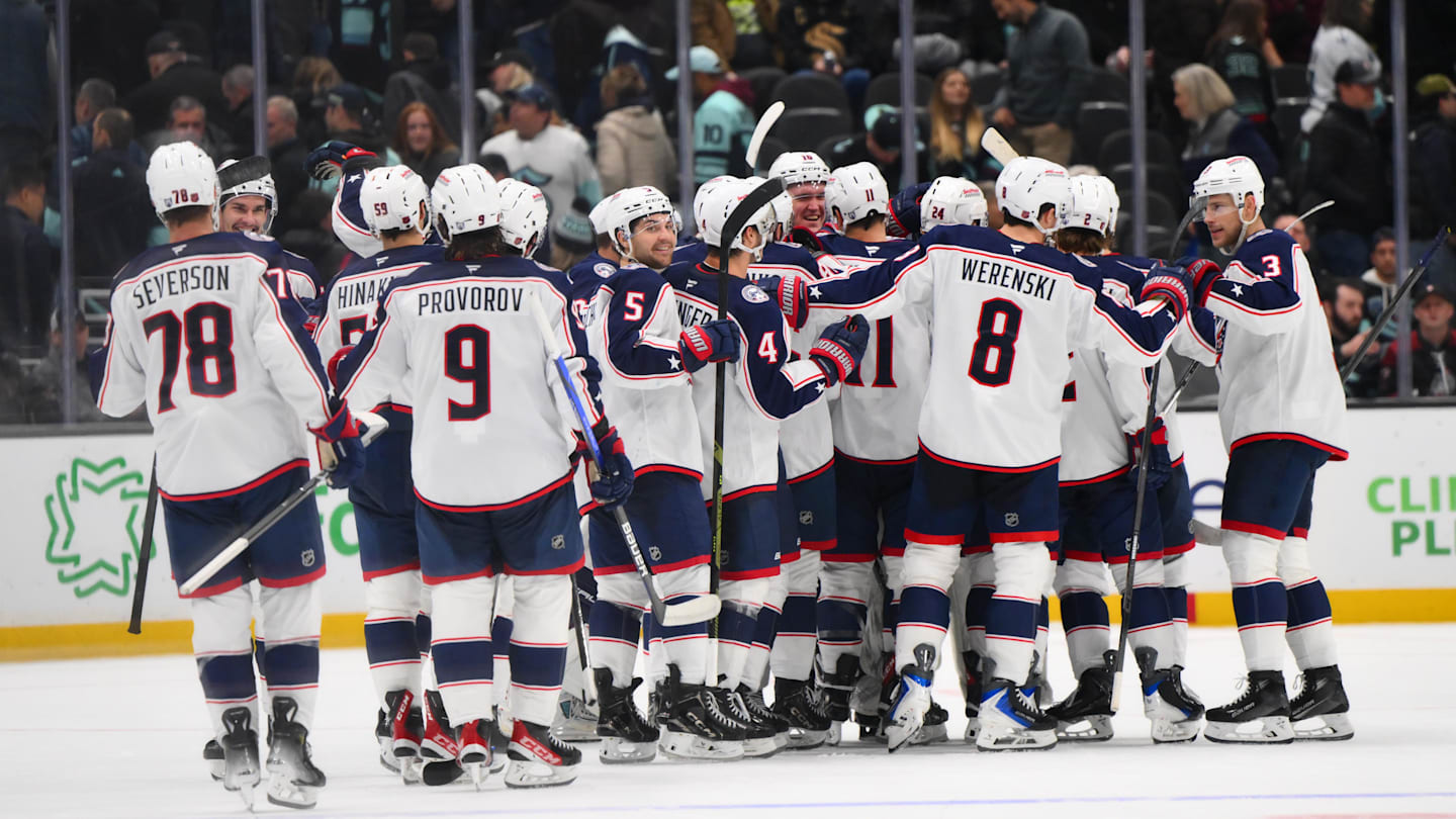 The Columbus Blue Jackets celebrate after defeating the Seattle Kraken during a shootout at Climate Pledge Arena
