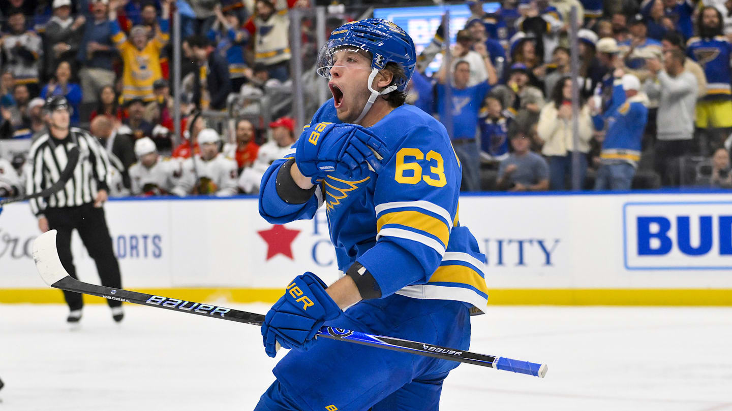 Oct 15, 2025; St. Louis, Missouri, USA; St. Louis Blues left wing Jake Neighbours (63) reacts after scoring against the Chicago Blackhawks during the first period at Enterprise Center. Mandatory Credit: Jeff Curry-Imagn Images