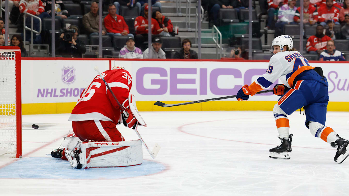 Nov 20, 2025; Detroit, Michigan, USA;  New York Islanders right wing Max Shabanov (49) shoots and scores on Detroit Red Wings goaltender John Gibson (36) in the third period at Little Caesars Arena. Mandatory Credit: Rick Osentoski-Imagn Images