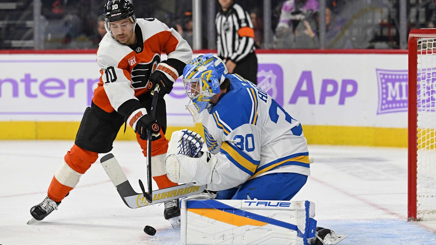 Nov 20, 2025; Philadelphia, Pennsylvania, USA; Philadelphia Flyers right wing Bobby Brink (10) reaches for the puck as St. Louis Blues goaltender Joel Hofer (30) makes a save during the first period at Xfinity Mobile Arena. Mandatory Credit: Eric Hartline-Imagn Images