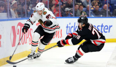 Dec 27, 2024; Buffalo, New York, USA;  Chicago Blackhawks right wing Ilya Mikheyev (95) and Buffalo Sabres defenseman Jacob Bryson (78) go after a loose puck during the first period at KeyBank Center. Mandatory Credit: Timothy T. Ludwig-Imagn Images