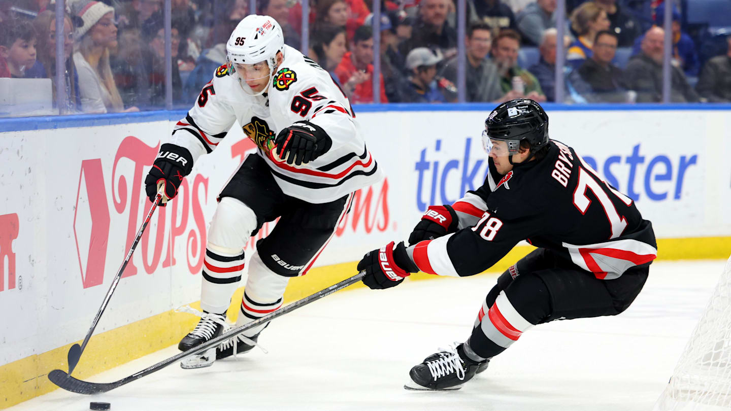Dec 27, 2024; Buffalo, New York, USA;  Chicago Blackhawks right wing Ilya Mikheyev (95) and Buffalo Sabres defenseman Jacob Bryson (78) go after a loose puck during the first period at KeyBank Center. Mandatory Credit: Timothy T. Ludwig-Imagn Images