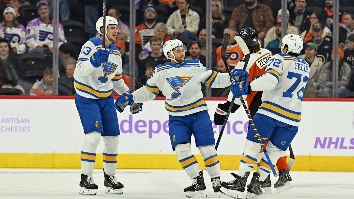 Nov 20, 2025; Philadelphia, Pennsylvania, USA; St. Louis Blues defenseman Justin Faulk (72) celebrates his goal with right wing Alexey Toropchenko (13) and left wing Nathan Walker (26)  against the Philadelphia Flyers  during the first period at Xfinity Mobile Arena. Mandatory Credit: Eric Hartline-Imagn Images