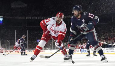 Blue Jackets defenseman Dante Fabbro works against Red Wings center Dylan Larkin at the Ohio Stadium.