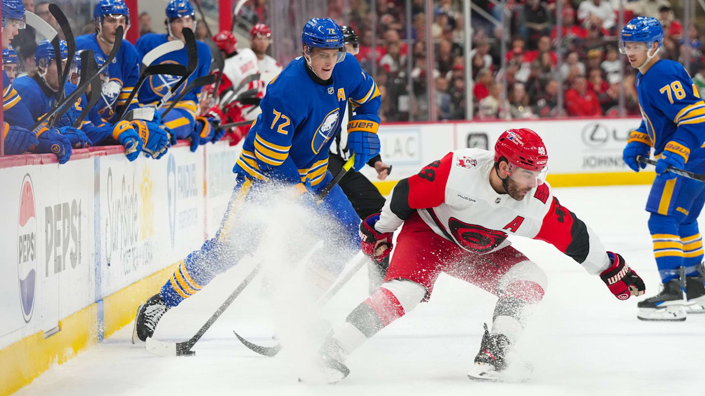 Nov 8, 2025; Raleigh, North Carolina, USA;  Buffalo Sabres center Tage Thompson (72) skates with the puck against Carolina Hurricanes left wing Jordan Martinook (48) during the second period at Lenovo Center. Mandatory Credit: James Guillory-Imagn Images