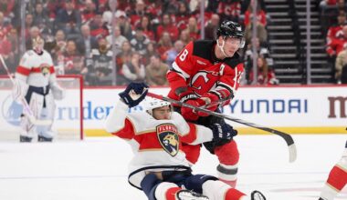 Oct 16, 2025; Newark, New Jersey, USA; New Jersey Devils left wing Ondrej Palat (18) hits Florida Panthers left wing A.J. Greer (10) during the first period at Prudential Center. Mandatory Credit: Ed Mulholland-Imagn Images