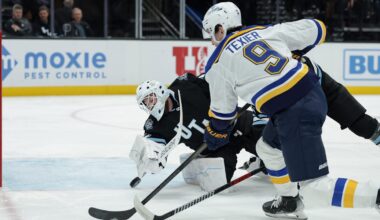 Feb 2, 2025; Salt Lake City, Utah, USA; Utah Hockey Club goaltender Connor Ingram (39) dives for the puck off of a St. Louis Blues center Alexandre Texier (9) shot during the first period at Delta Center. Mandatory Credit: Chris Nicoll-Imagn Images