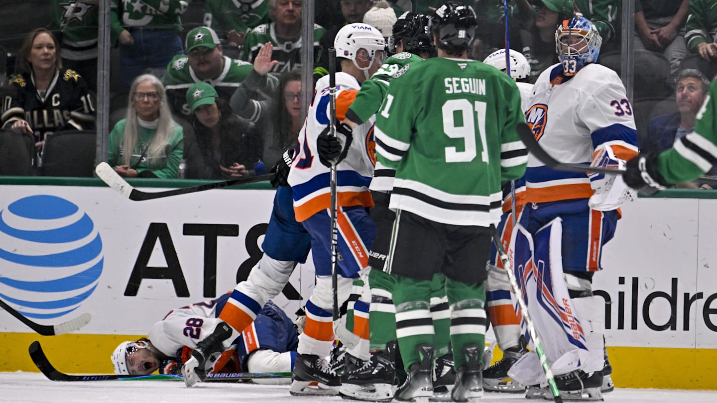 Nov 18, 2025; Dallas, Texas, USA; Dallas Stars right wing Mikko Rantanen (96) is called for a game misconduct penalty for boarding on New York Islanders defenseman Alexander Romanov (28) during the third period at the American Airlines Center. Mandatory Credit: Jerome Miron-Imagn Images