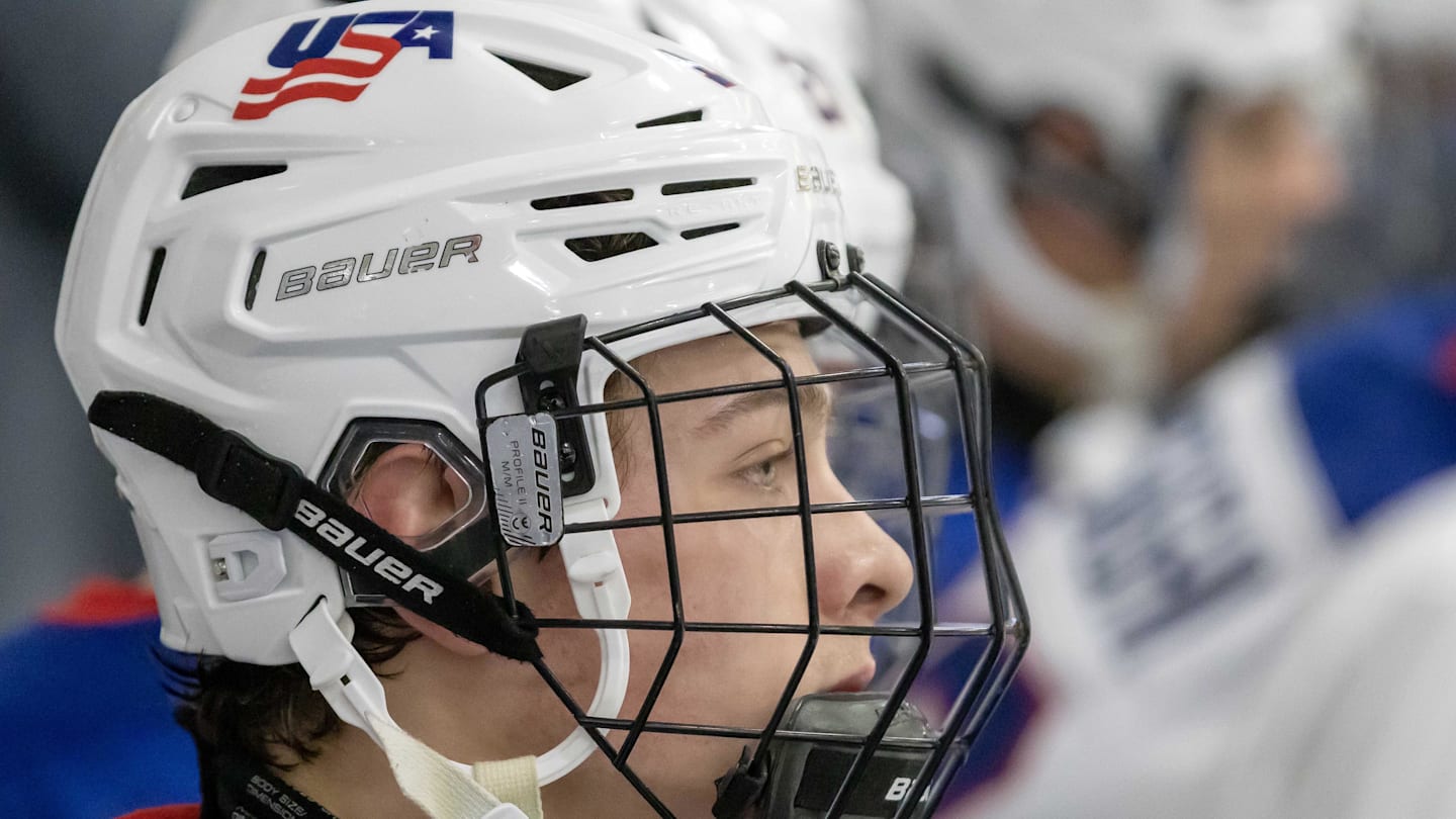 Feb 7, 2024; Plymouth, MI, USA; USA s James Hagens (10) watches the action from the bench against Finland during the third period of the 2024 U18 s Five Nations Tournament at USA Hockey Arena. Mandatory Credit: David Reginek-Imagn Images