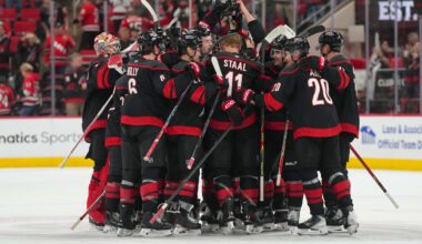 Nov 6, 2025; Raleigh, North Carolina, USA;  Carolina Hurricanes players celebrate their victory against the Minnesota Wild at Lenovo Center. Mandatory Credit: James Guillory-Imagn Images
