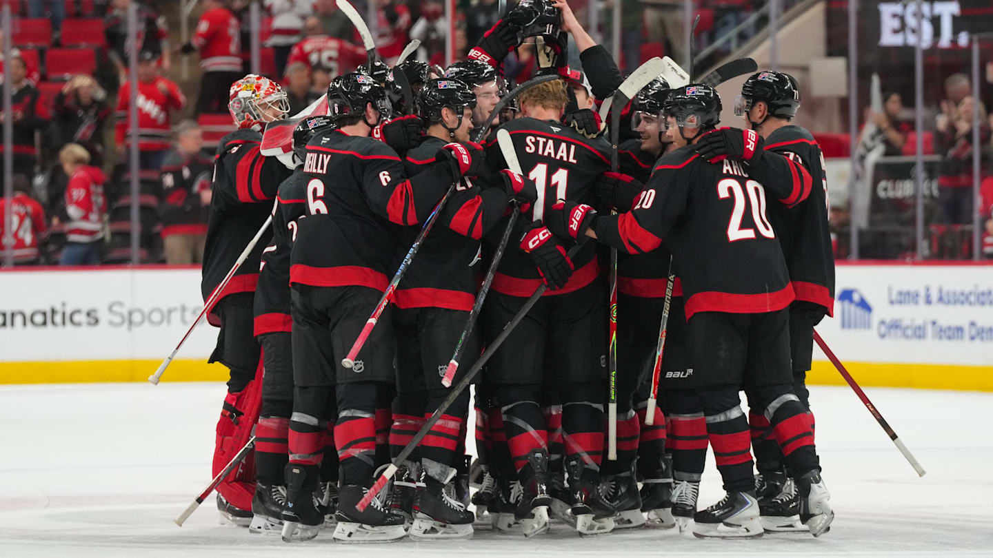 Nov 6, 2025; Raleigh, North Carolina, USA;  Carolina Hurricanes players celebrate their victory against the Minnesota Wild at Lenovo Center. Mandatory Credit: James Guillory-Imagn Images