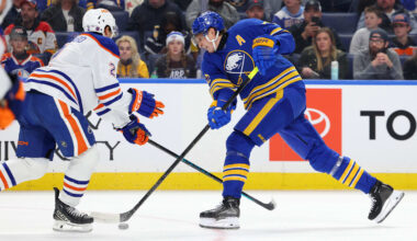 Nov 17, 2025; Buffalo, New York, USA;  Edmonton Oilers defenseman Evan Bouchard (2) tries to block a shot by Buffalo Sabres center Tage Thompson (72) during the second period at KeyBank Center. Mandatory Credit: Timothy T. Ludwig-Imagn Images
