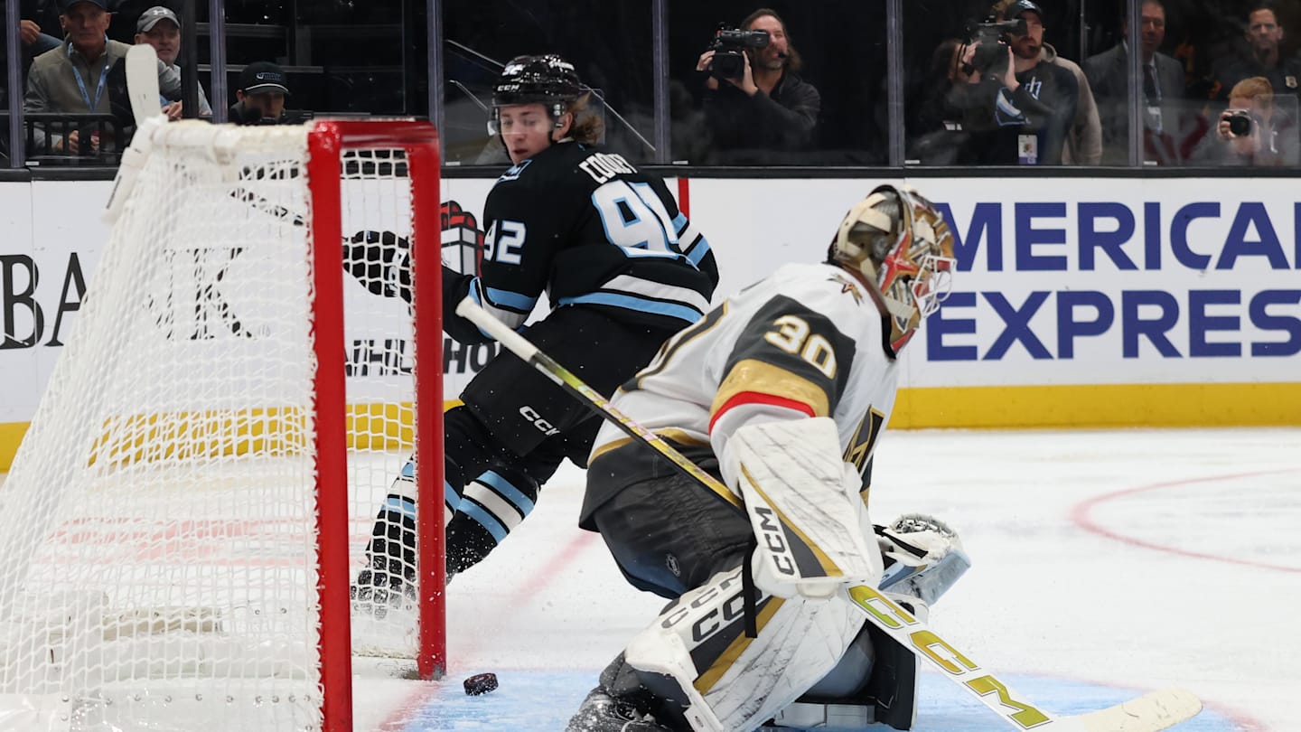 Nov 24, 2025; Salt Lake City, Utah, USA; Utah Mammoth center Logan Cooley (92) looks back to watch the puck go in the net past Vegas Golden Knights goaltender Carl Lindbom (30) during the third period at Delta Center. Mandatory Credit: Rob Gray-Imagn Images