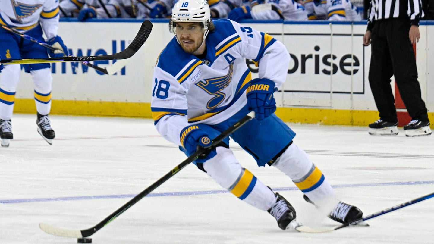 Nov 24, 2025; New York, New York, USA; St. Louis Blues center Robert Thomas (18) skates with the puck against the New York Rangers during the third period at Madison Square Garden. Mandatory Credit: Dennis Schneidler-Imagn Images