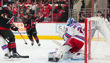 Nov 26, 2025; Raleigh, North Carolina, USA; Carolina Hurricanes center Seth Jarvis (24) scores a goal past New York Rangers goaltender Igor Shesterkin (31) during the third period at Lenovo Center. Mandatory Credit: James Guillory-Imagn Images
