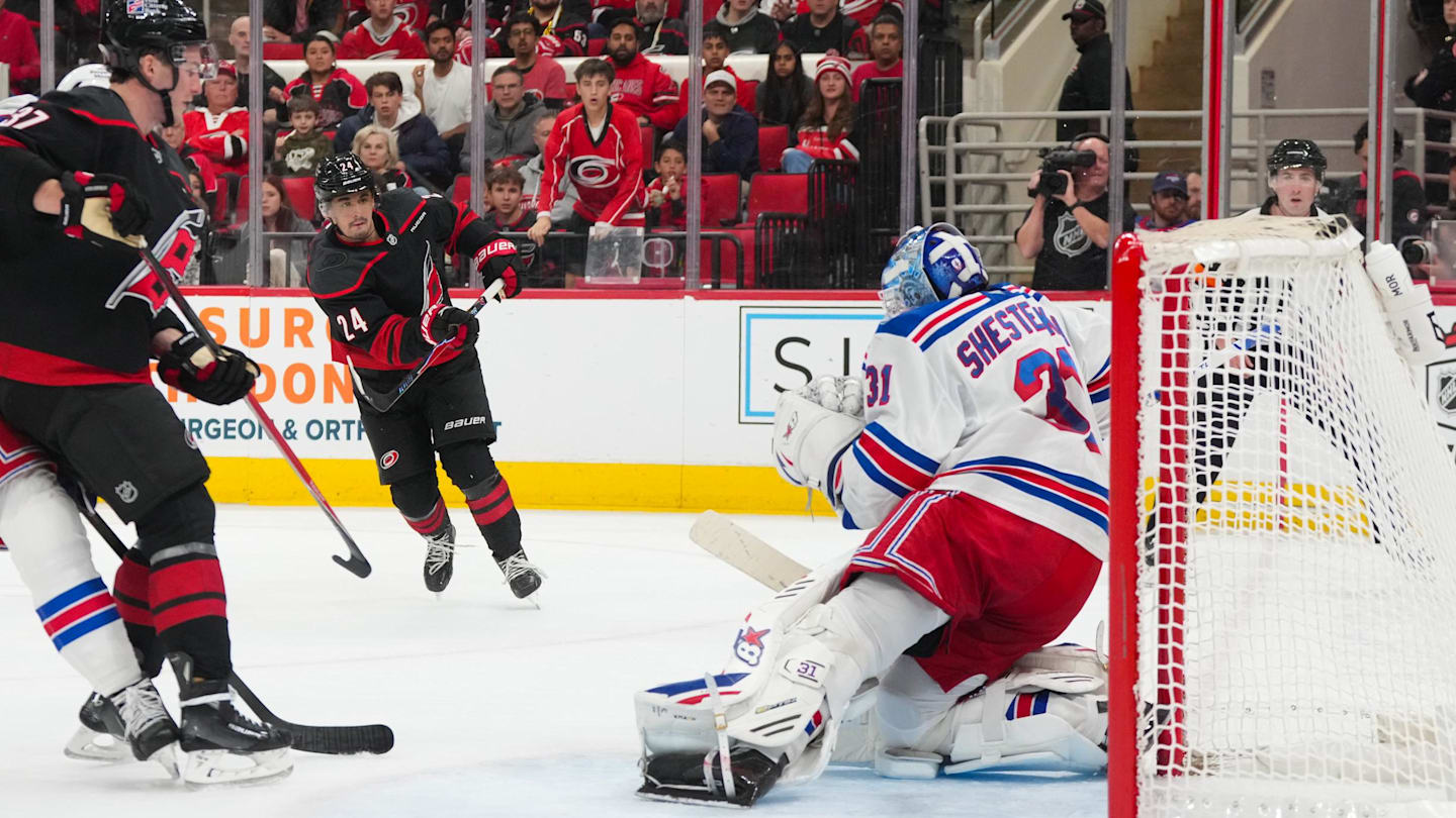 Nov 26, 2025; Raleigh, North Carolina, USA; Carolina Hurricanes center Seth Jarvis (24) scores a goal past New York Rangers goaltender Igor Shesterkin (31) during the third period at Lenovo Center. Mandatory Credit: James Guillory-Imagn Images