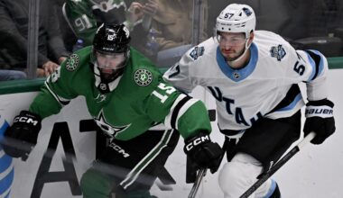 Apr 12, 2025; Dallas, Texas, USA; Dallas Stars center Colin Blackwell (15) and Utah Hockey Club defenseman Nick DeSimone (57) chase the puck lduring the third period at the American Airlines Center. Mandatory Credit: Jerome Miron-Imagn Images