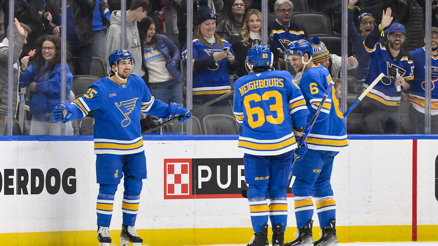 Nov 28, 2025; St. Louis, Missouri, USA; St. Louis Blues right wing Jordan Kyrou (25) celebrates with left wing Jake Neighbours (63) and defenseman Philip Broberg (6) after scoring against the Ottawa Senators during the third period at Enterprise Center. Mandatory Credit: Jeff Curry-Imagn Images